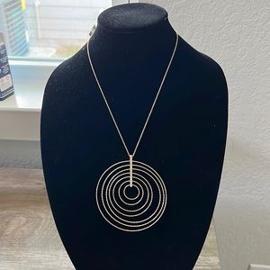 Gold with Rhinestones necklace with large circular pendant.